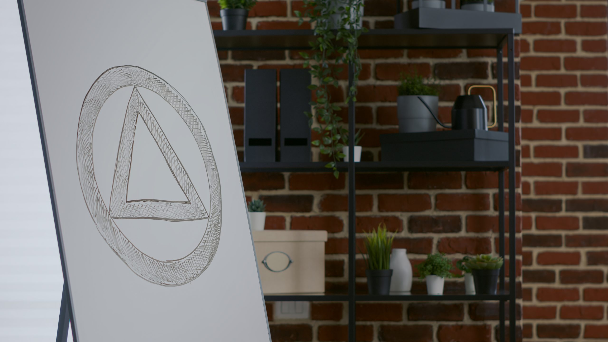 AA Triangle on easel in typical meeting room